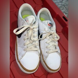 Nike Women’s White Leather Sneakers with Brown Trim and Black Swoosh